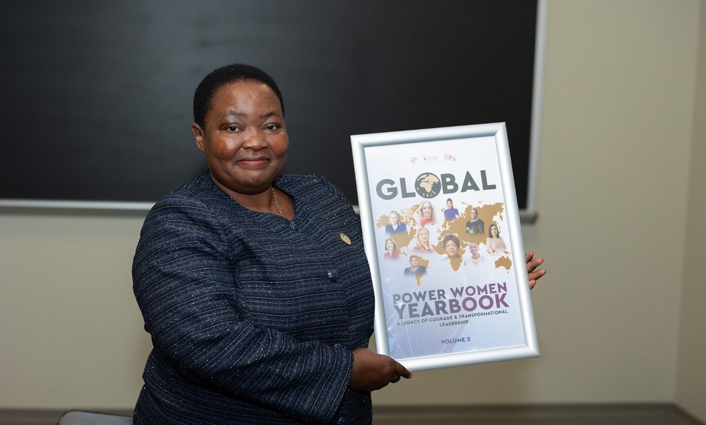 Robinah Nabbanja, Prime Minister of Uganda holding the Global Power Women YearBook frame