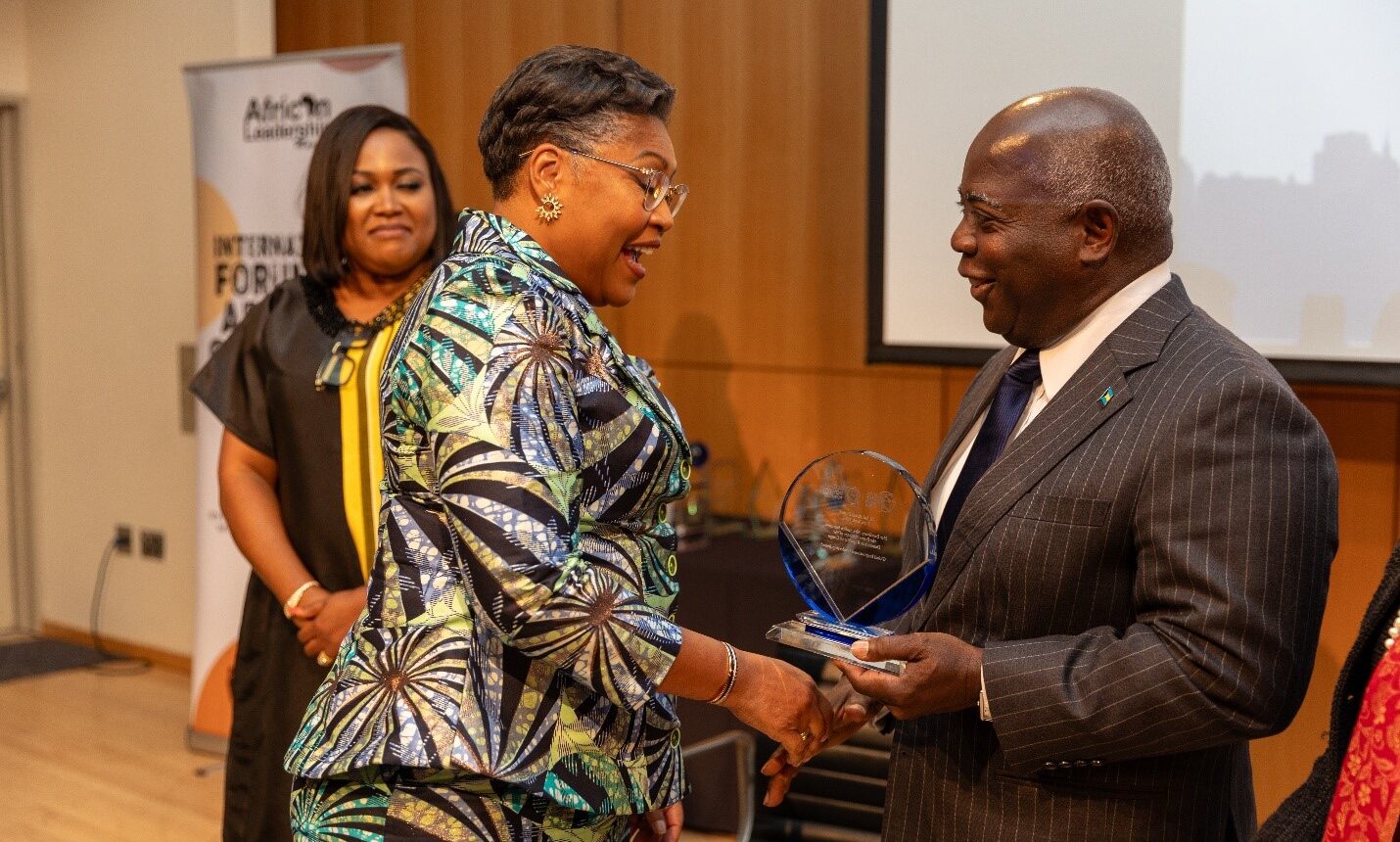 Right - Prime Minister Philip Davis of the Bahamas presenting the Female Impact Award to HE Judith Suminwa Tuluka, Prime Minister of the Democratic Republic of the Congo at GPWF 2025 New York Event